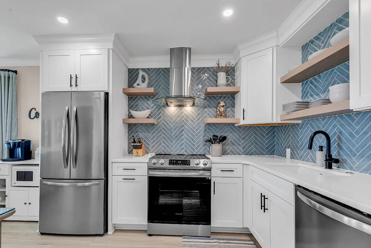 Renovated kitchen with herringbone backsplash